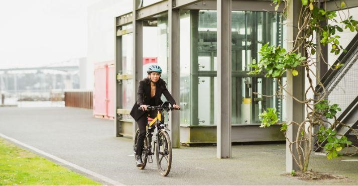 Hotel-staff-using-bicycle-to-go-from-one-building-to-another