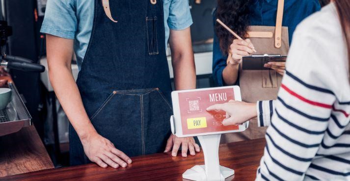 Customer-using-self-service-tablet-kiosk