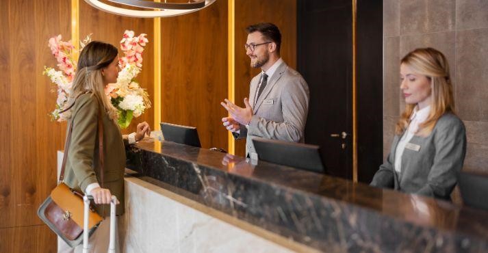 Receptionists-checking-in-a-guest-in-a-typical-chain-hotel